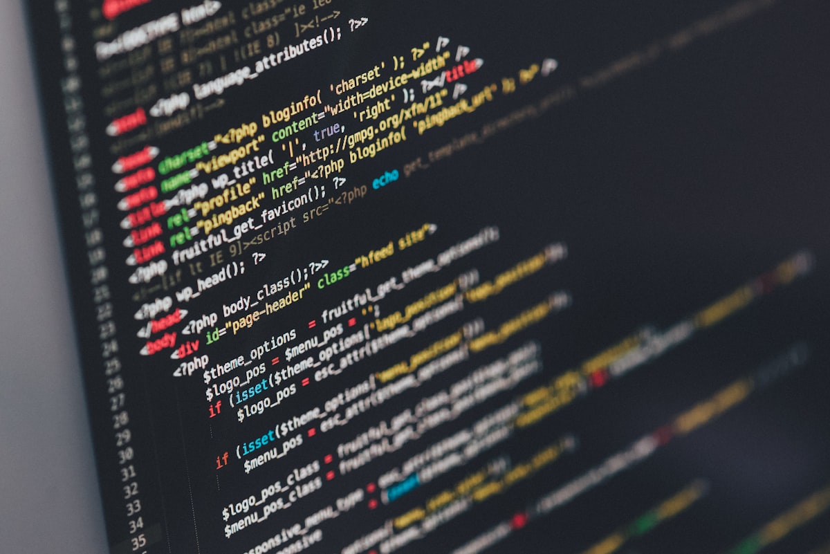 Developer workspace with computer displaying code, representing web development with Astro and Tailwind CSS